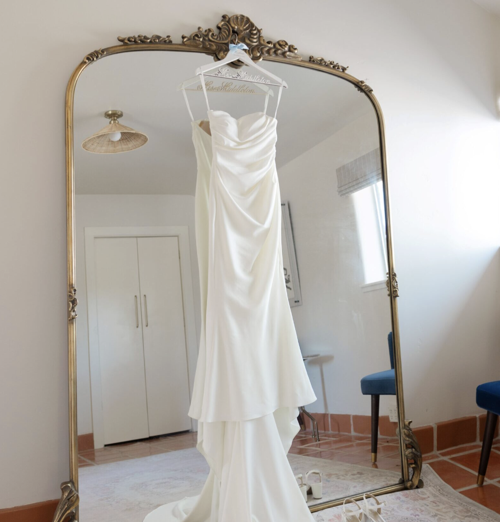 Wedding dress reflected in the full-length mirror inside the Wedding Cottage