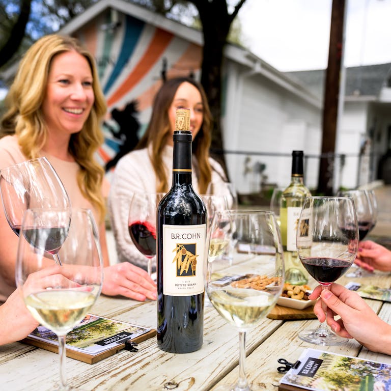 Guests enjoying B.R. Cohn wines by the bottle and glass